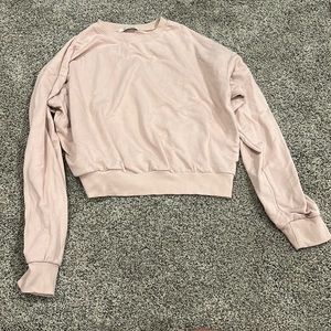 light pink sweater size large but not large AT ALL super cute and simple
